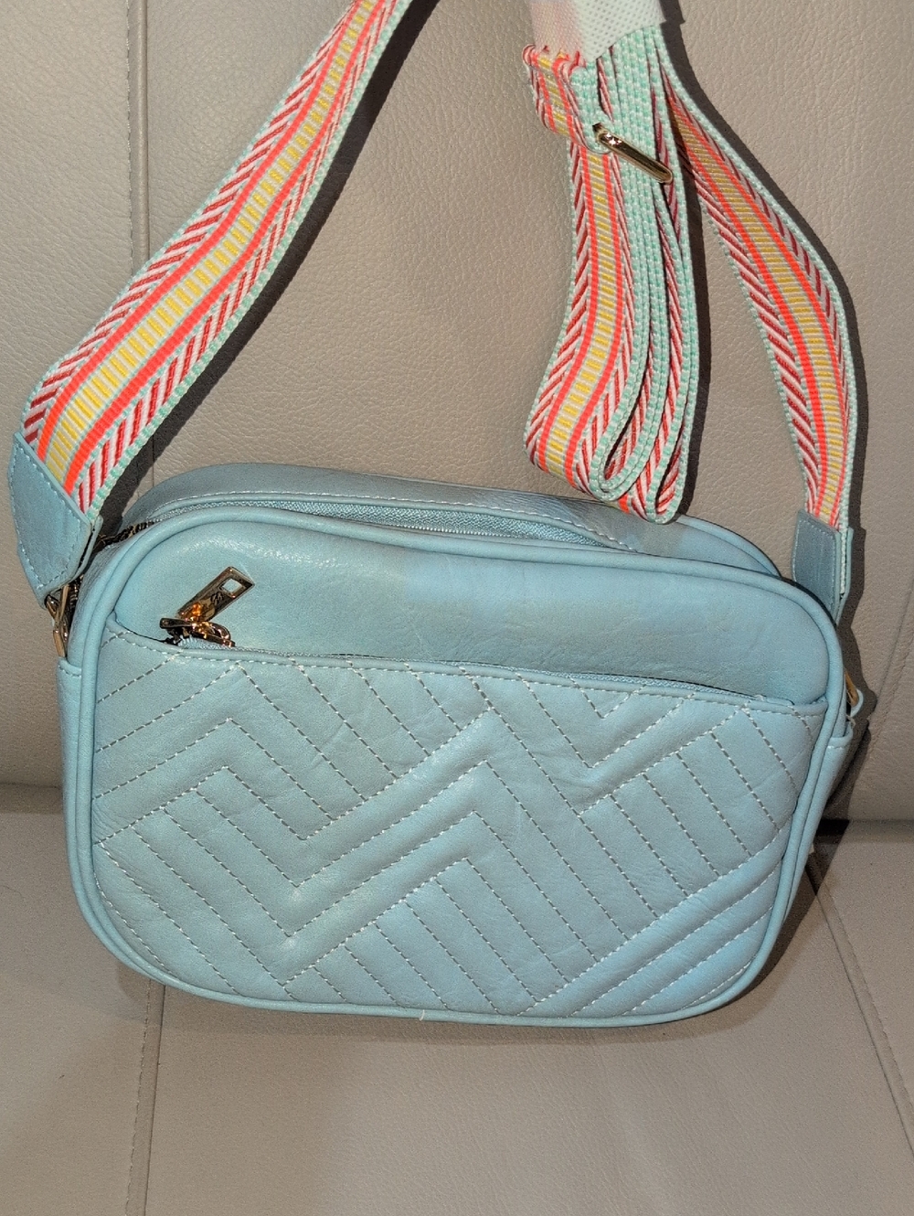 Light Blue Quilted Crossbody Bag with Colorful Woven Strap